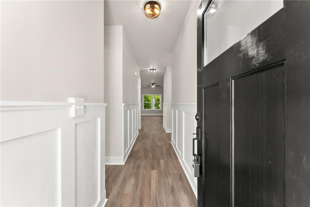 43 Anderson Street Jefferson, GA 30549 - Photo 5 of 45 a view of a hallway with wooden floor and entryway