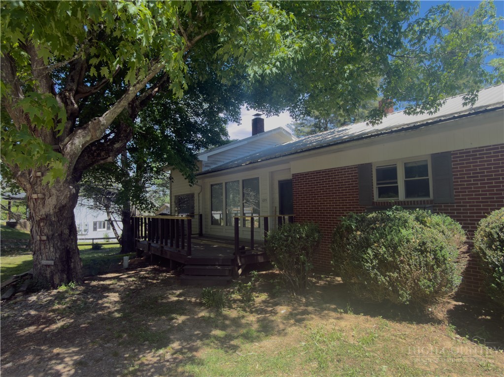 1205 Bamboo Road Boone, NC 28607 - Photo 1 of 17 a view of a house with a tree in the yard
