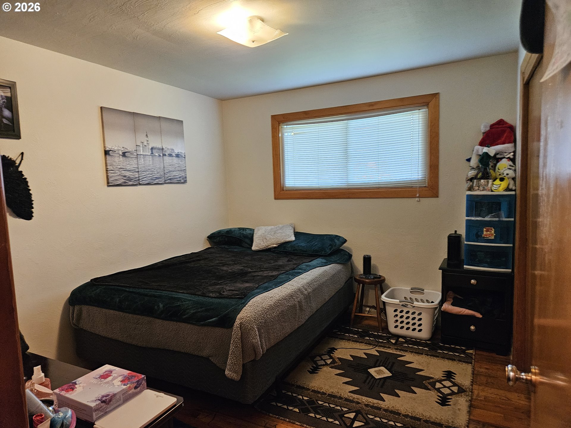 4747 Homer Road Northeast Salem, OR 97305 - Photo 11 of 21 a bedroom with a bed and wooden floor