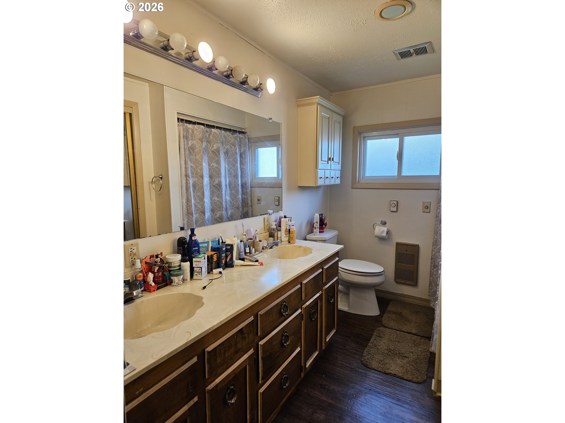4747 Homer Road Northeast Salem, OR 97305 - Photo 18 of 21 a bathroom with a double vanity sink mirror and toilet