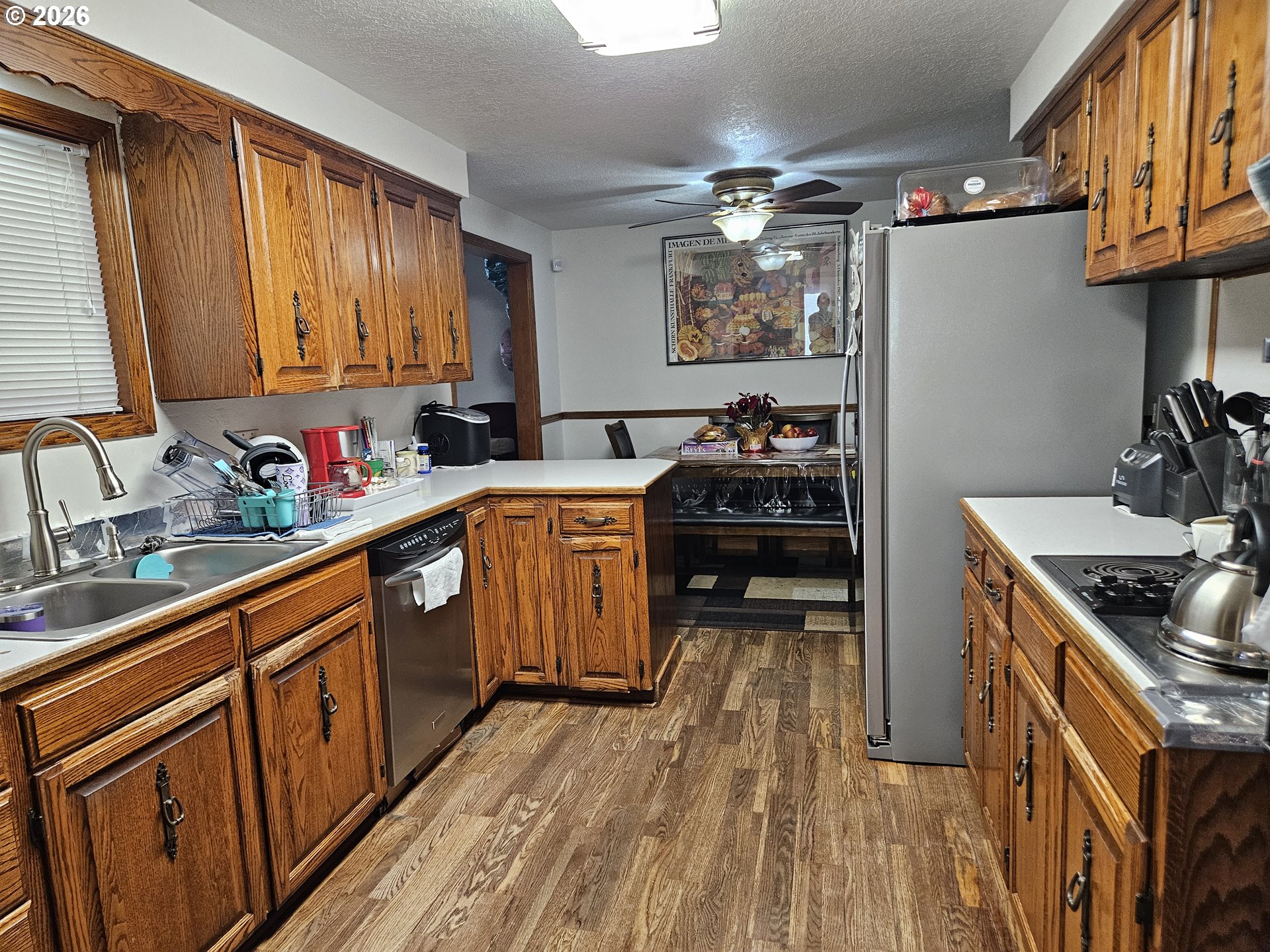 4747 Homer Road Northeast Salem, OR 97305 - Photo 7 of 21 a kitchen with stainless steel appliances a sink dishwasher stove and refrigerator