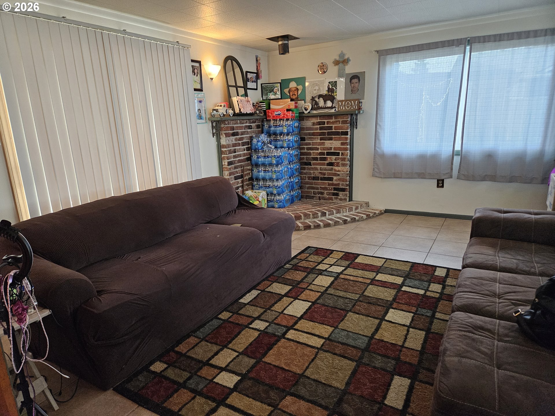 4747 Homer Road Northeast Salem, OR 97305 - Photo 8 of 21 a living room with a couch and a walk in closet