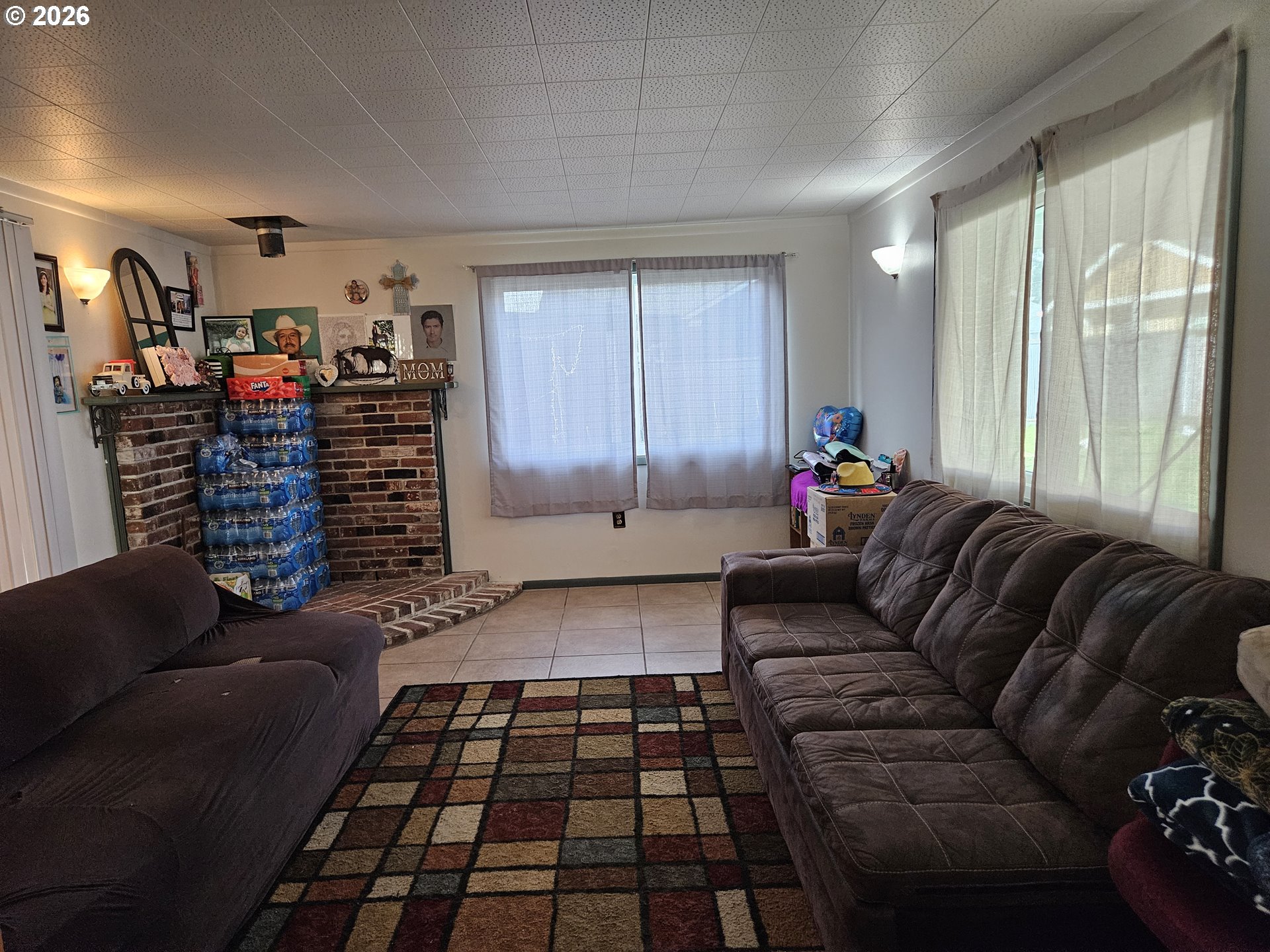 4747 Homer Road Northeast Salem, OR 97305 - Photo 9 of 21 a living room with furniture and a floor to ceiling window