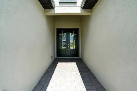 a front view of house with a garden