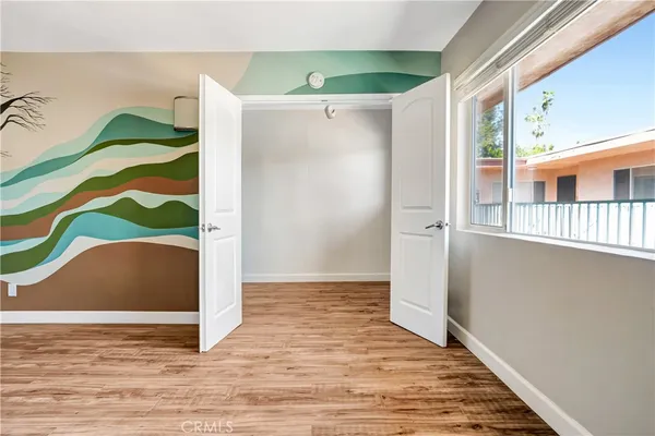 a view of an entryway with wooden floor