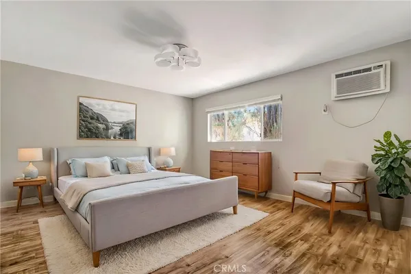 a bedroom with a large bed and a couch