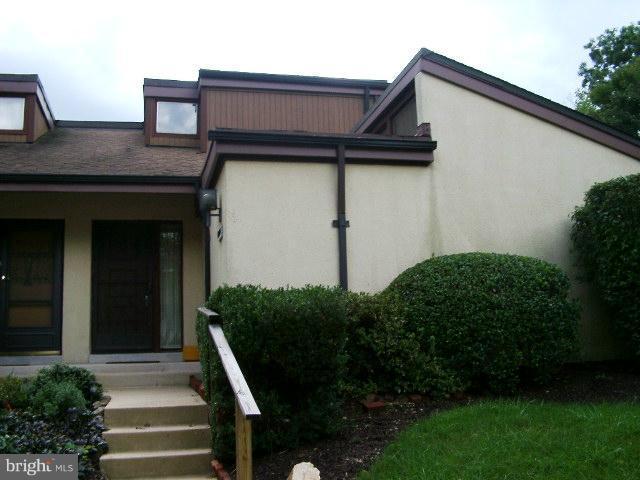 11236 B Powder Run, Unit B Columbia, MD 21044 - Photo 7 of 7 a house that has a potted plant on it