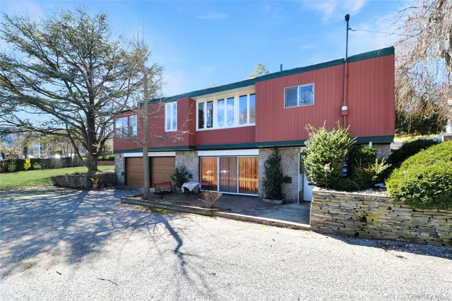 a backyard of a house with yard and outdoor seating