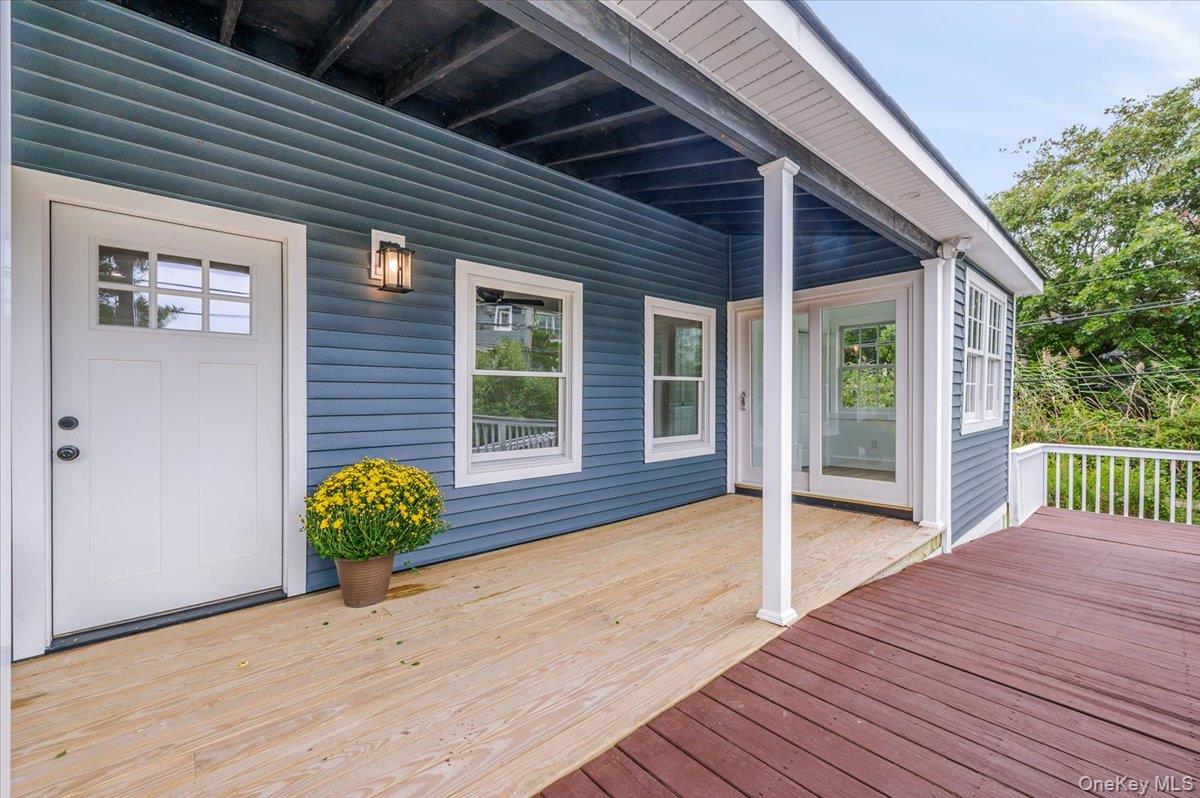 56 Oak Beach Road Babylon, NY 11702 - Photo 4 of 30 New deck that wraps around the covered front porch.