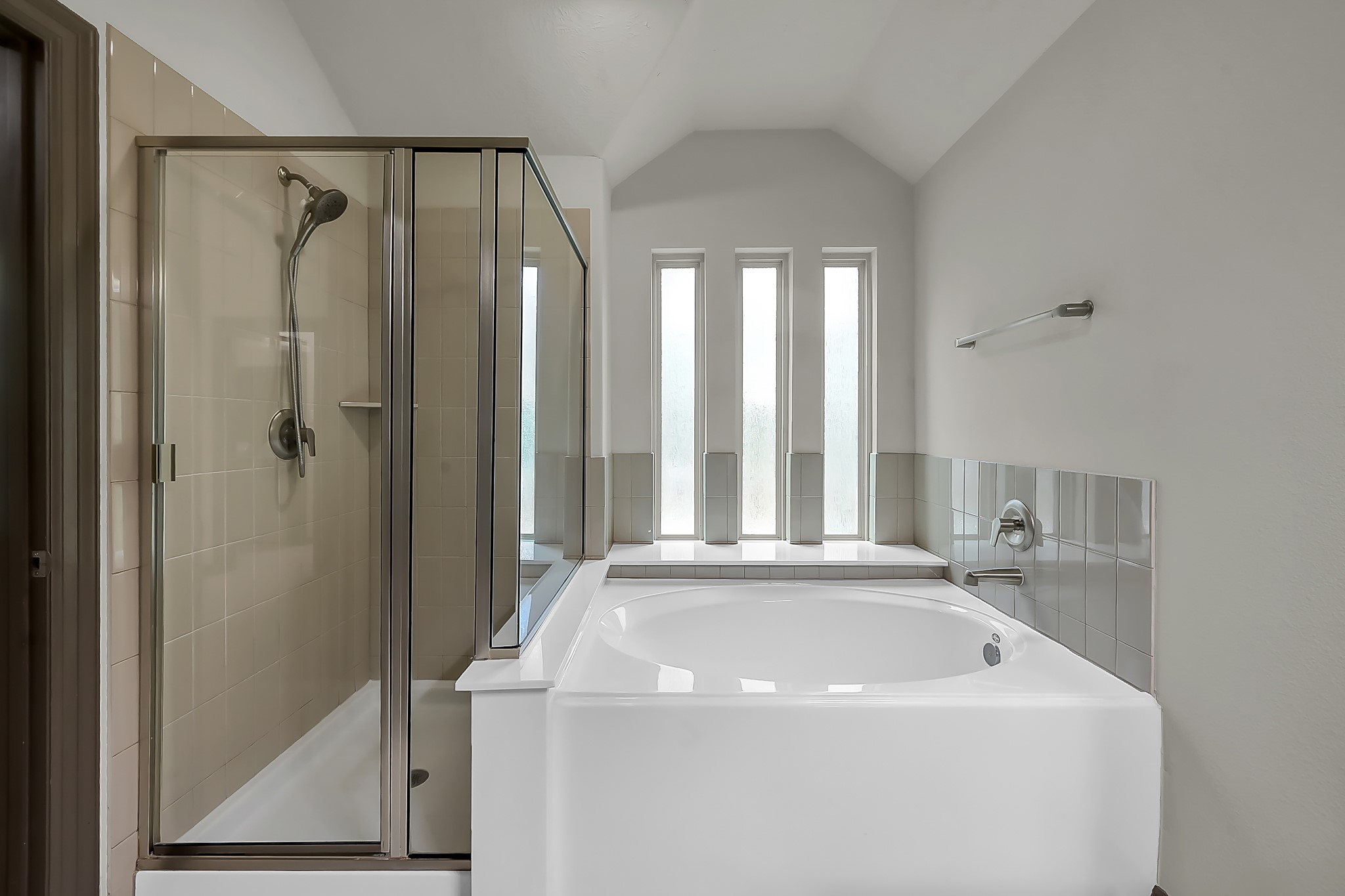 18 Aventura Place Spring, TX 77389 - Photo 24 of 43 a bathroom with a bathtub and a shower