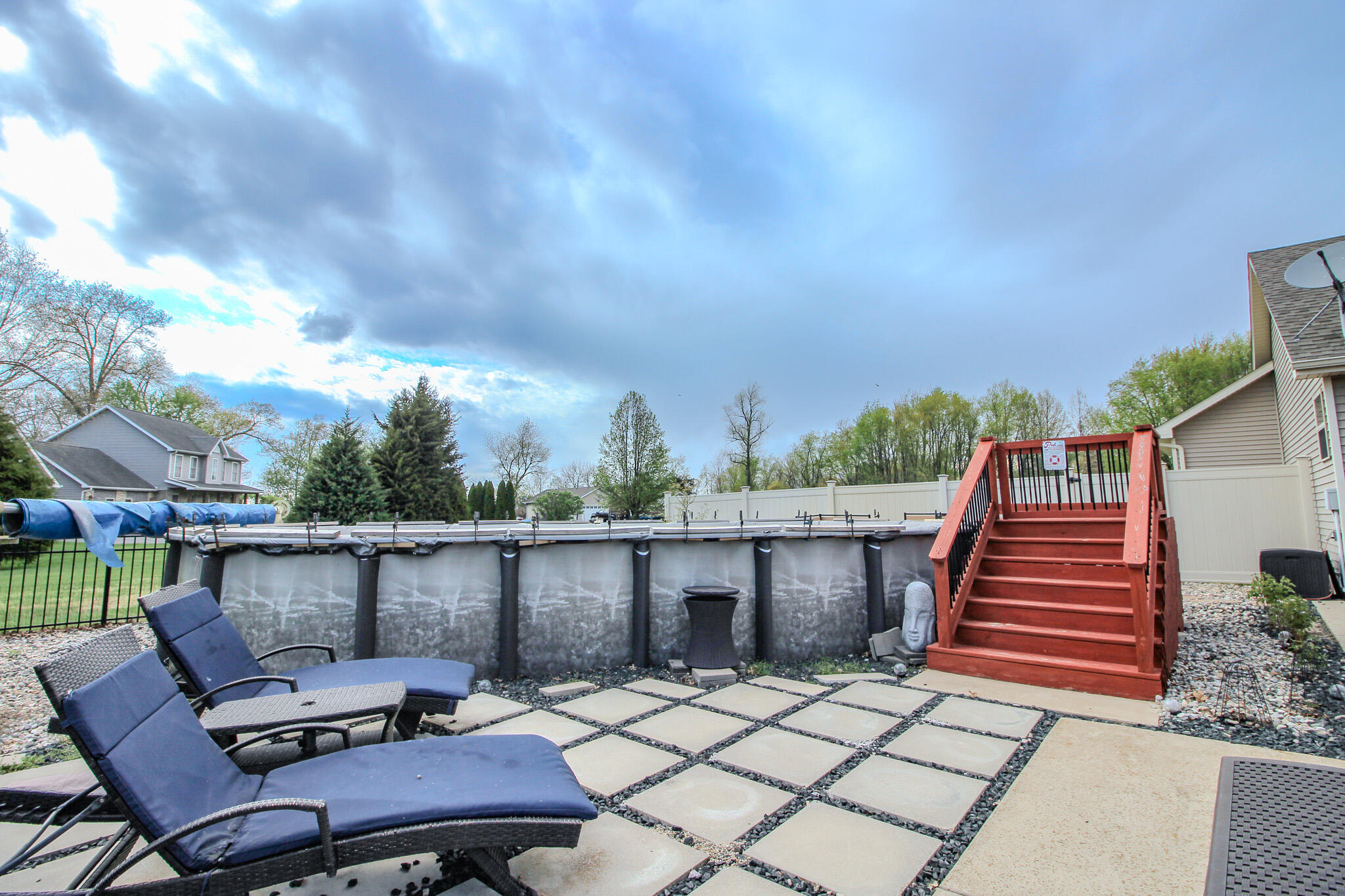 2913 Cardinal Drive Wheatfield, IN 46392 - Photo 4 of 34 a backyard of a house with table and chairs