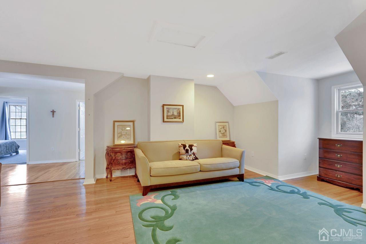 381 Plainfield Road Edison, NJ 08820 - Photo 20 of 23 a living room with furniture and a wooden floor