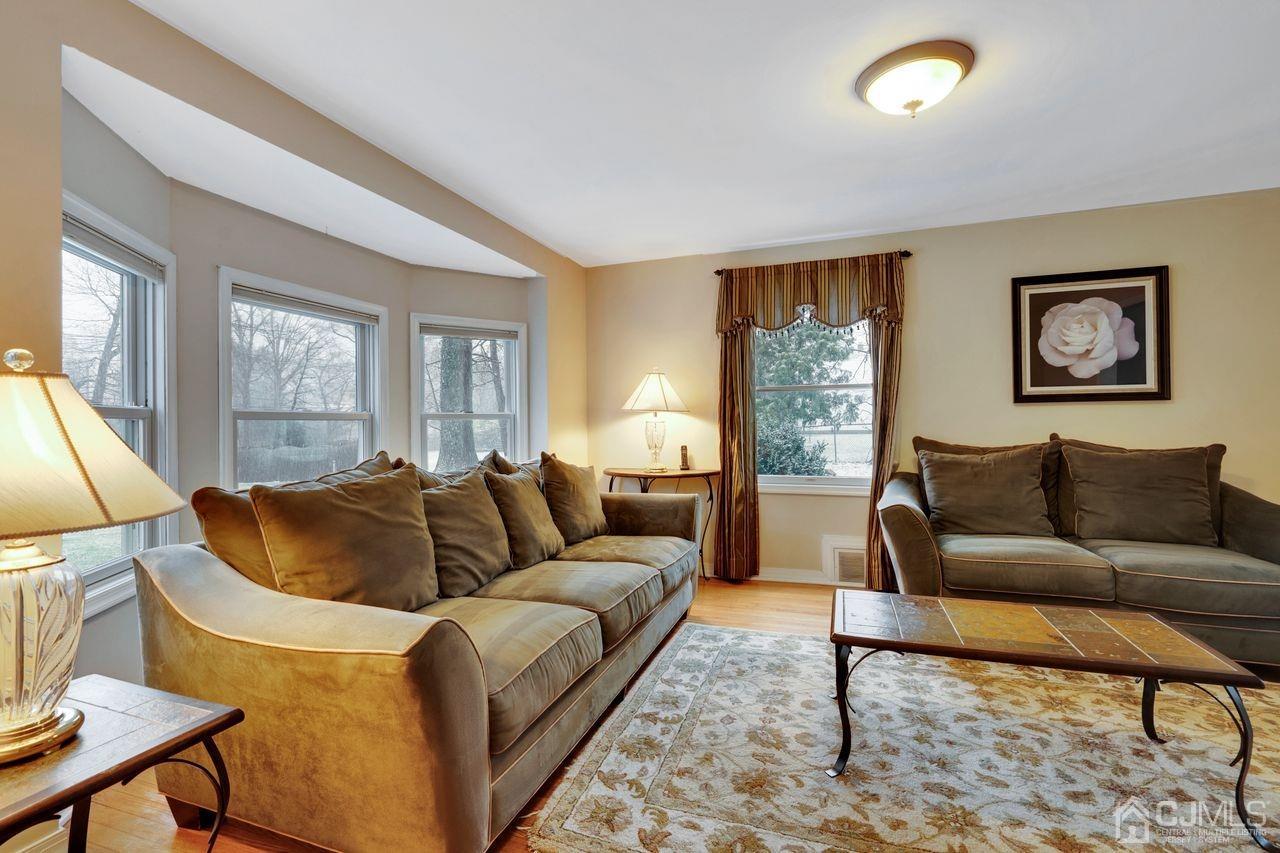 381 Plainfield Road Edison, NJ 08820 - Photo 8 of 23 a living room with furniture and a large window