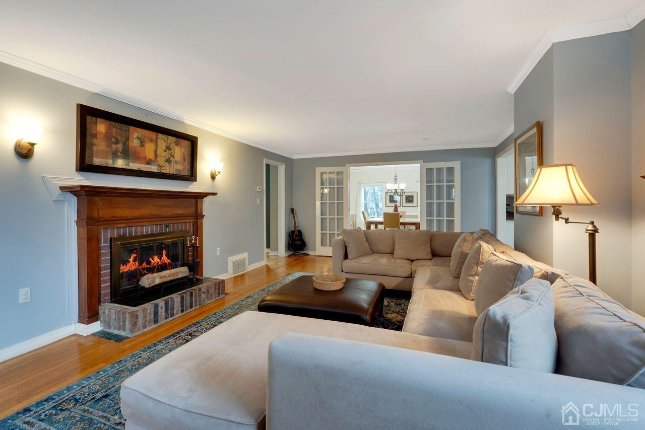 381 Plainfield Road Edison, NJ 08820 - Photo 10 of 23 a living room with furniture and a fireplace