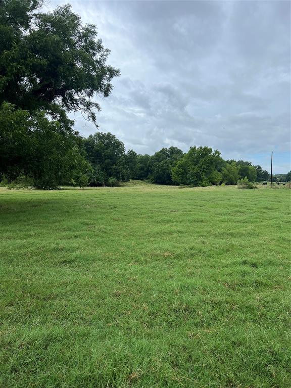 Tbd Abel Lane Boyd, TX 76023 - Photo 4 of 4 a view of a field with an trees in the background