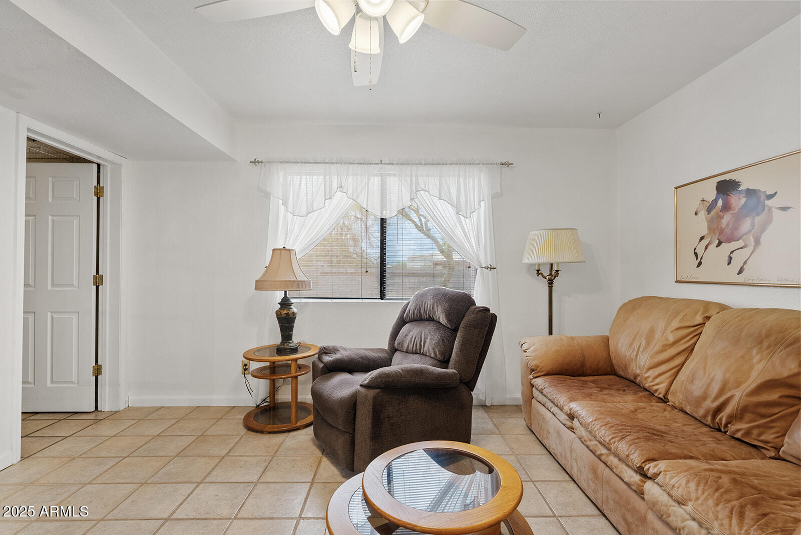 75 North Val Vista Road Apache Junction, AZ 85119 - Photo 11 of 39 a living room with furniture a couch and a chandelier