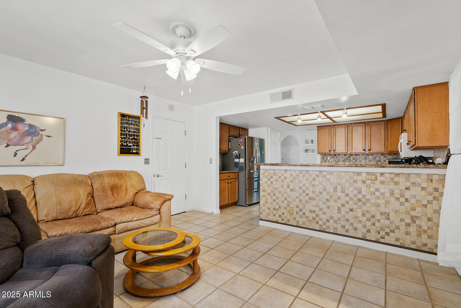 75 North Val Vista Road Apache Junction, AZ 85119 - Photo 12 of 39 a living room with furniture and a chandelier