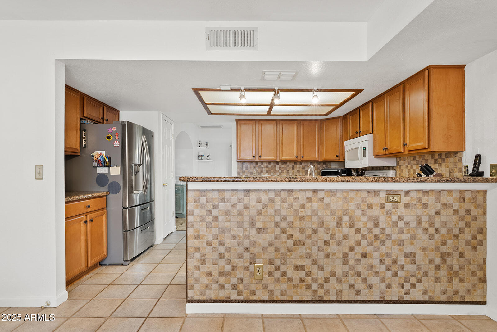 75 North Val Vista Road Apache Junction, AZ 85119 - Photo 13 of 39 a kitchen with stainless steel appliances a refrigerator and microwave