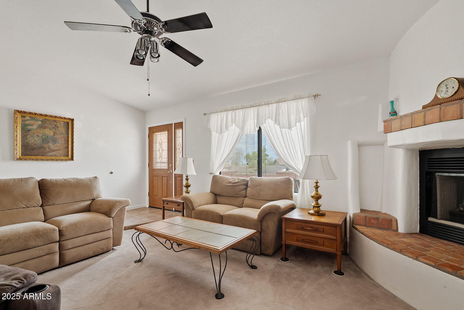 75 North Val Vista Road Apache Junction, AZ 85119 - Photo 14 of 39 a living room with furniture and a fireplace