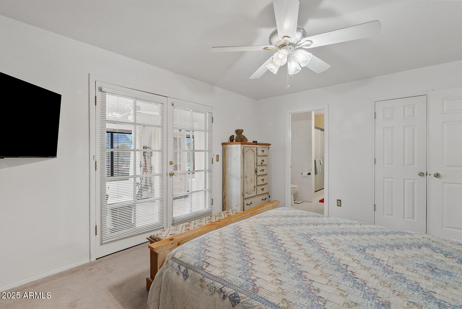 75 North Val Vista Road Apache Junction, AZ 85119 - Photo 19 of 39 a bedroom with a bed and a flat screen tv