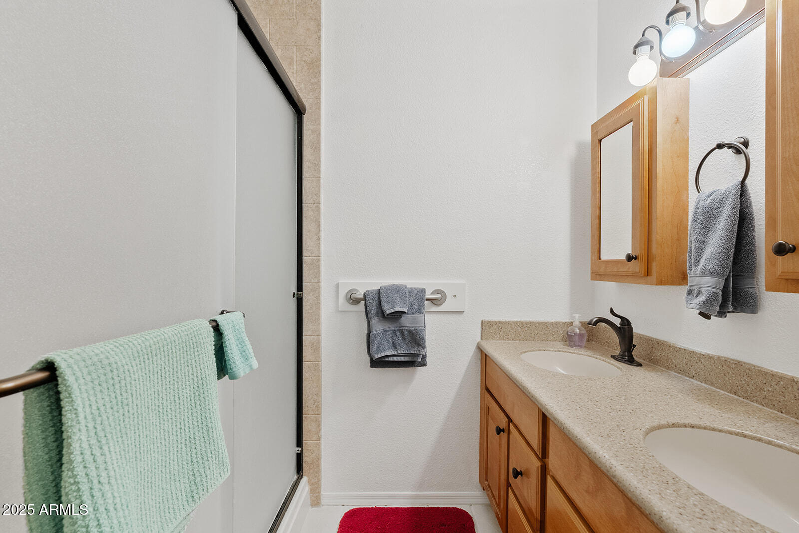 75 North Val Vista Road Apache Junction, AZ 85119 - Photo 20 of 39 a bathroom with a sink and mirror