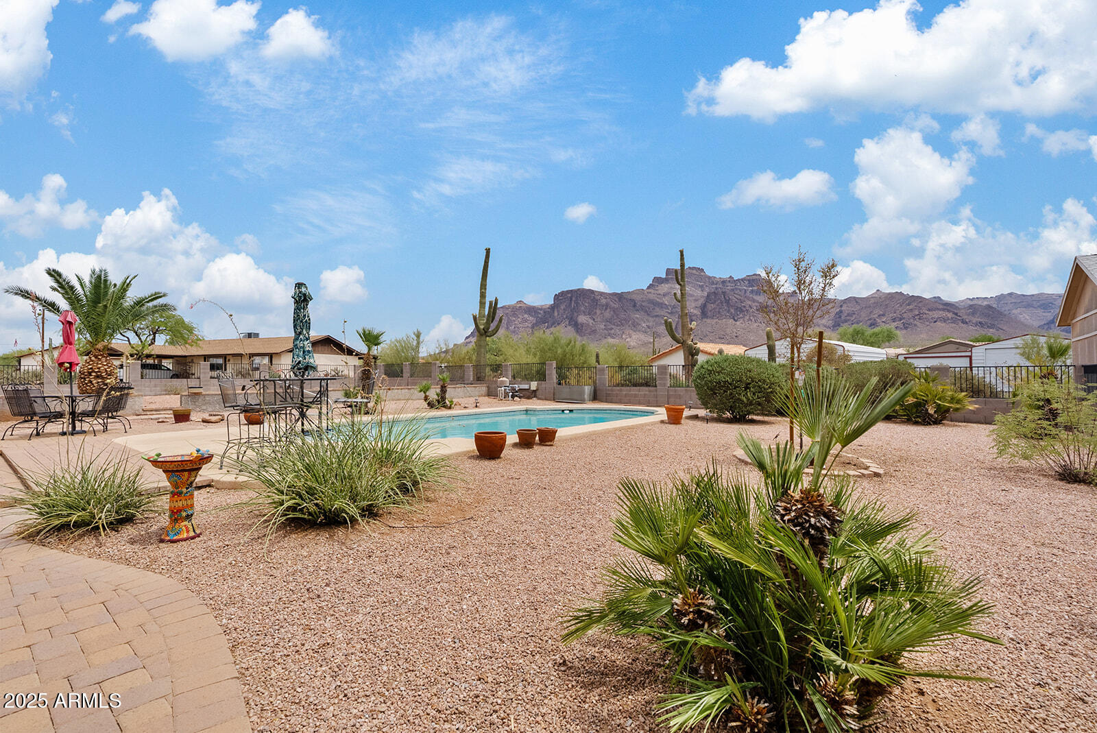 75 North Val Vista Road Apache Junction, AZ 85119 - Photo 2 of 39 a view of a swimming pool and trees in the background