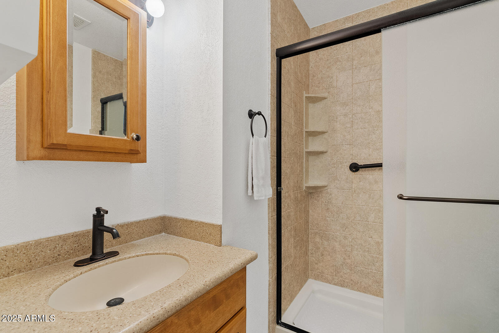 75 North Val Vista Road Apache Junction, AZ 85119 - Photo 24 of 39 a bathroom with a sink and a mirror