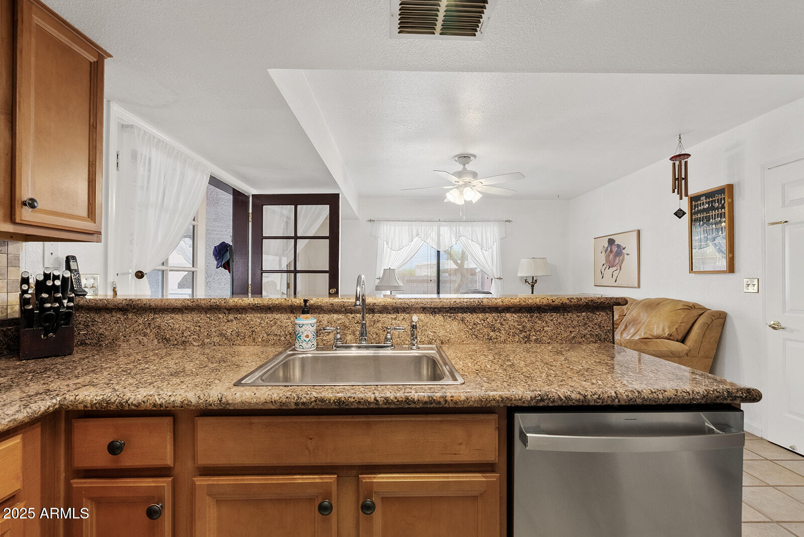 75 North Val Vista Road Apache Junction, AZ 85119 - Photo 10 of 39 a kitchen with granite countertop a sink a counter top space and cabinets
