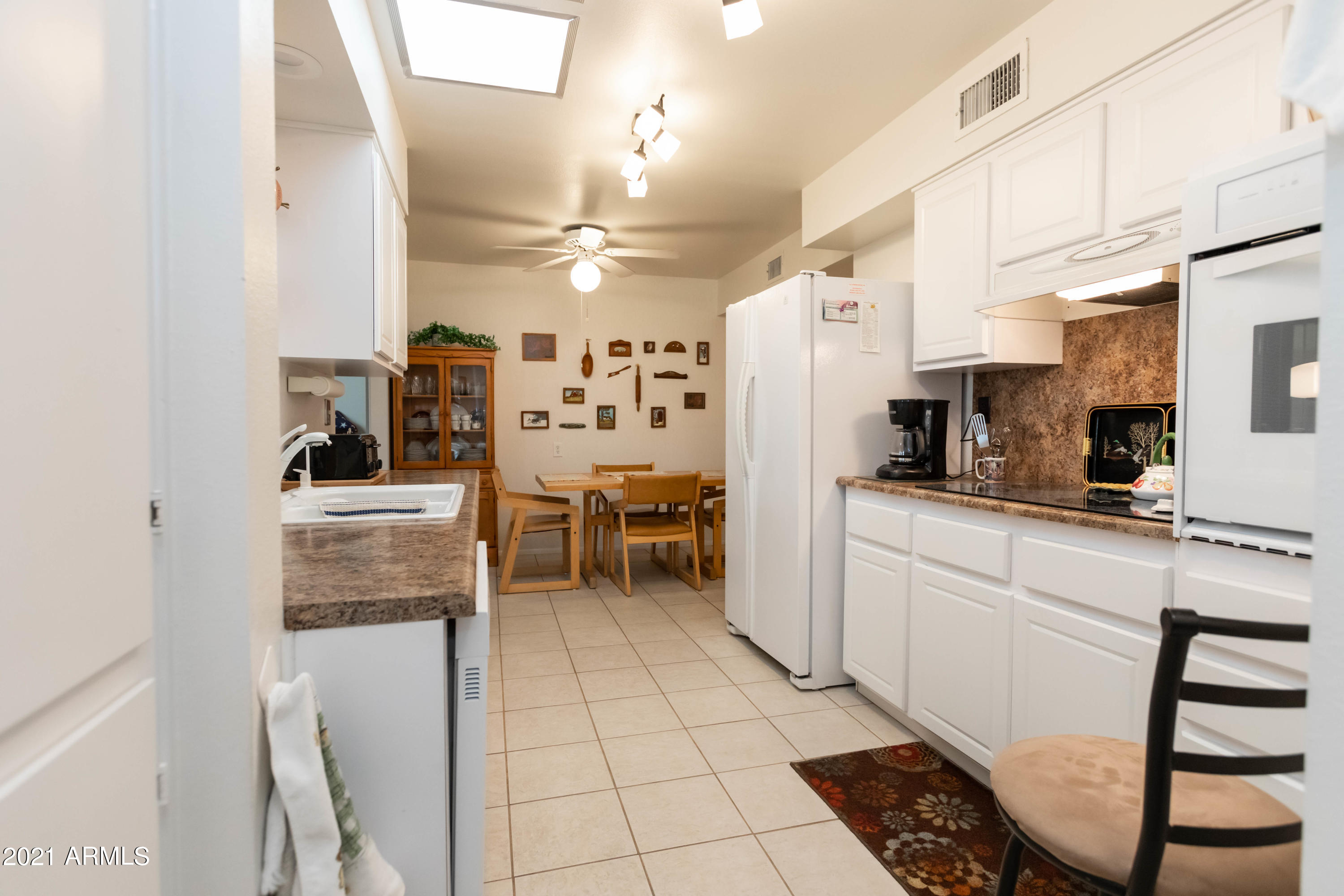 10207 West Royal Oak Road Sun City, AZ 85351 - Photo 13 of 38 kitchen and dinette