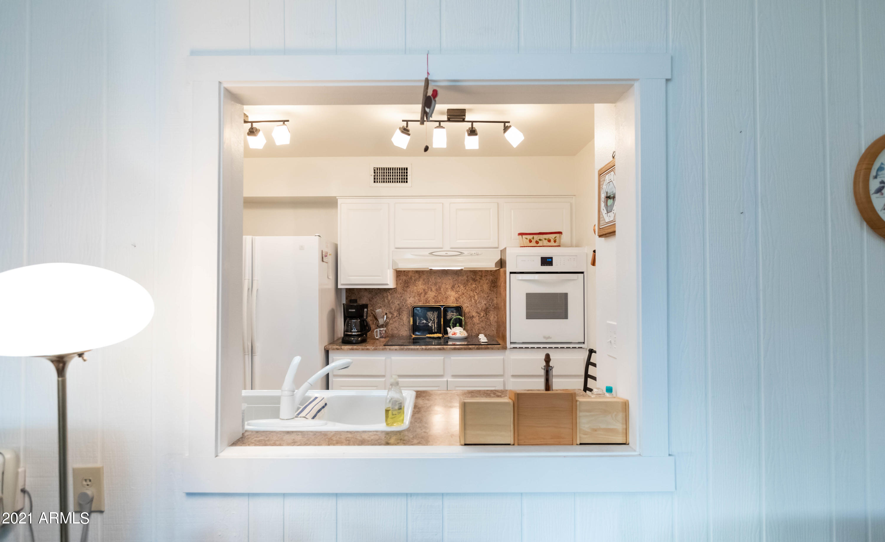 10207 West Royal Oak Road Sun City, AZ 85351 - Photo 14 of 38 kitchen to Arizona room