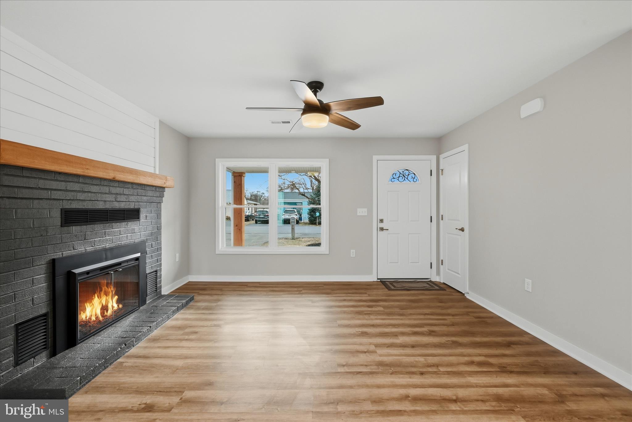 217 Myrtle Avenue Winchester, VA 22601 - Photo 12 of 52 a view of empty room with fireplace and fan