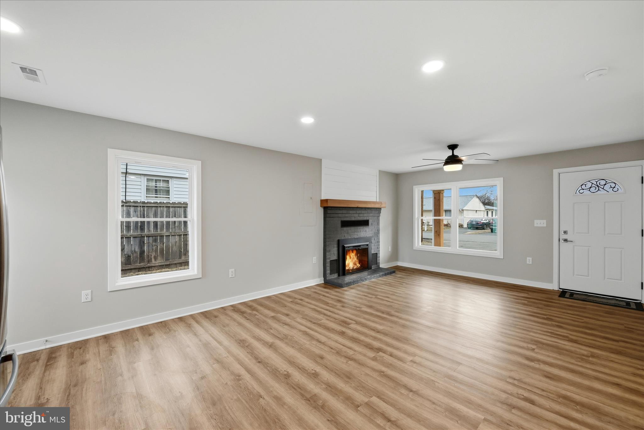 217 Myrtle Avenue Winchester, VA 22601 - Photo 16 of 52 an empty room with windows fireplace and windows