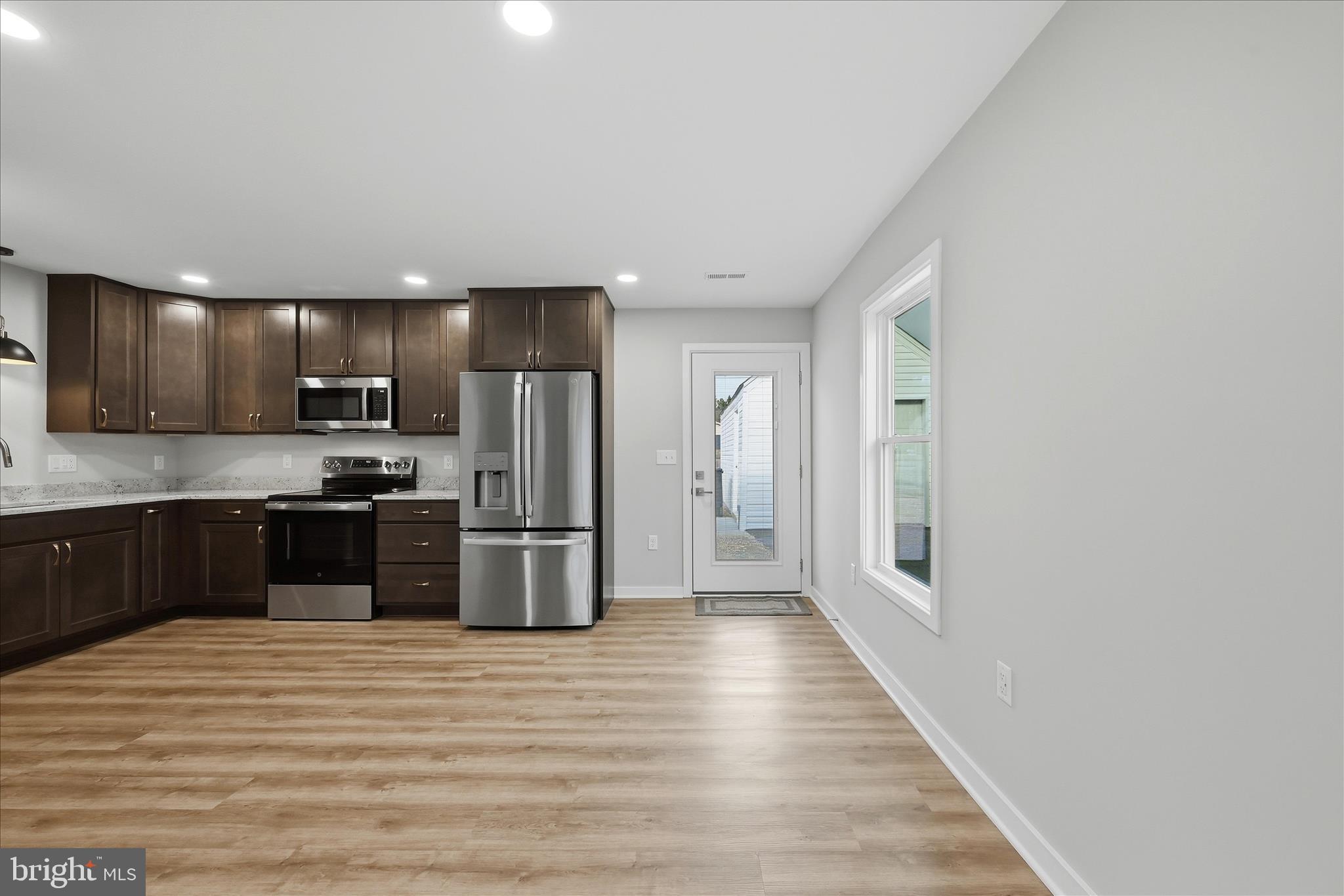 217 Myrtle Avenue Winchester, VA 22601 - Photo 17 of 52 a kitchen with stainless steel appliances a refrigerator and a stove top oven