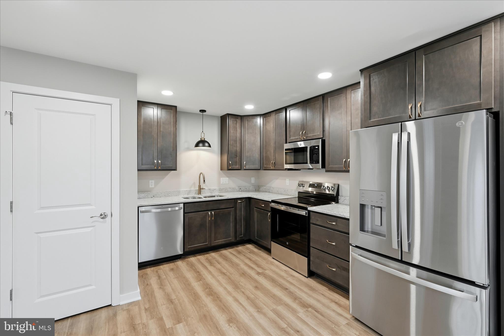 217 Myrtle Avenue Winchester, VA 22601 - Photo 18 of 52 a kitchen with stainless steel appliances granite countertop a refrigerator stove and sink