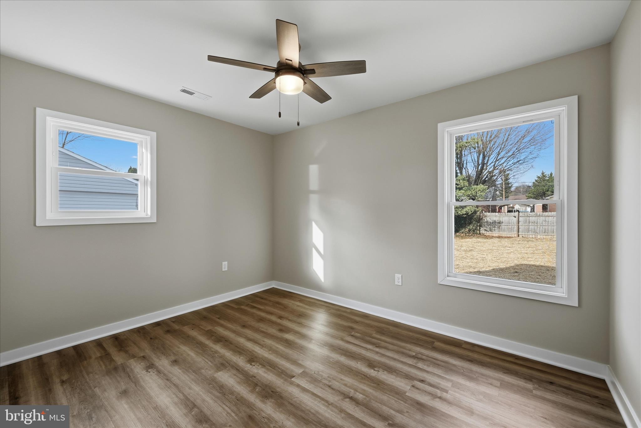 217 Myrtle Avenue Winchester, VA 22601 - Photo 28 of 52 a view of an empty room with wooden floor and a window