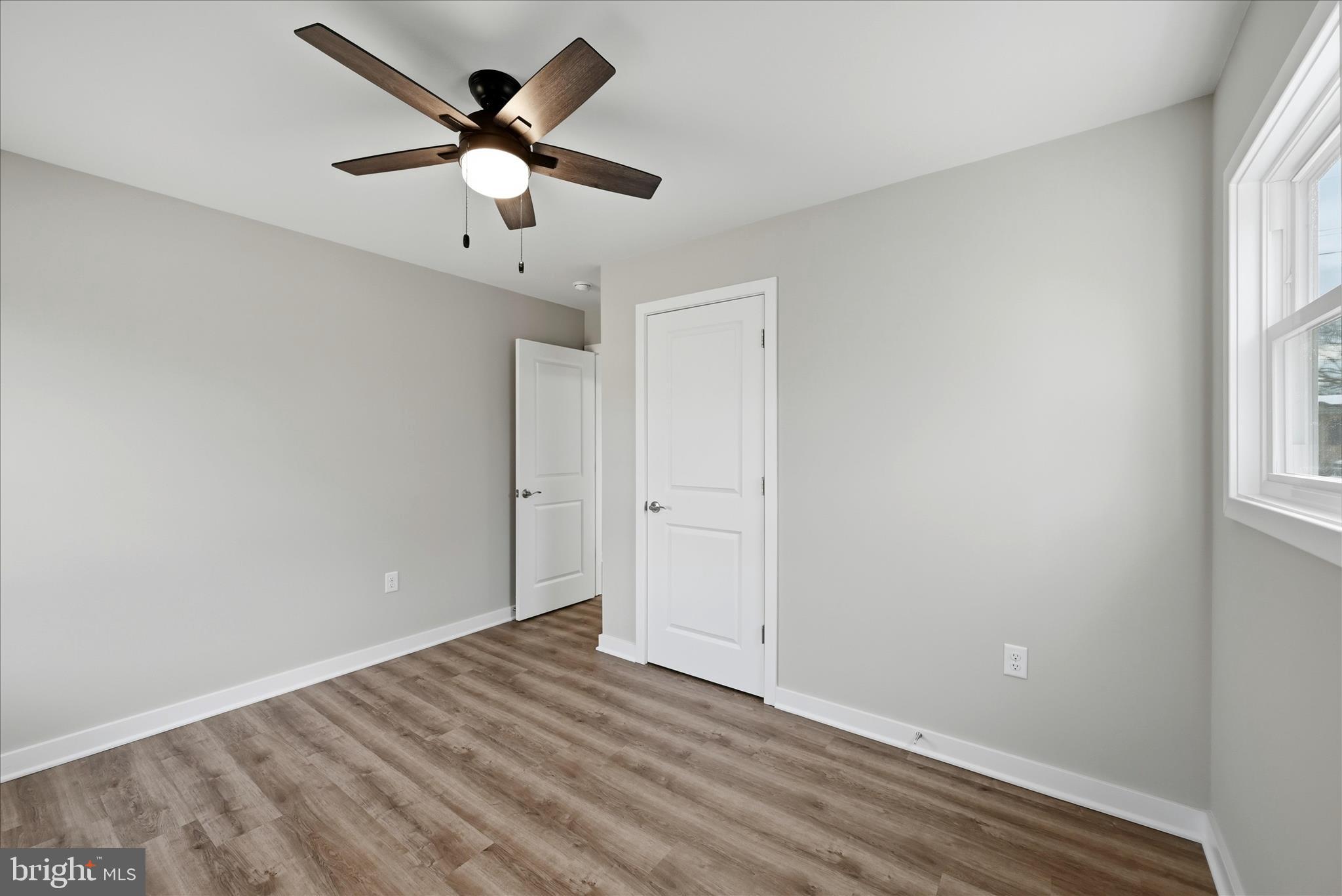 217 Myrtle Avenue Winchester, VA 22601 - Photo 29 of 52 wooden floor in an empty room with a window
