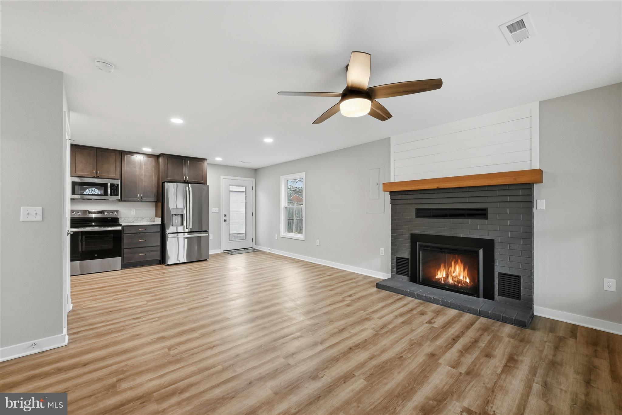 217 Myrtle Avenue Winchester, VA 22601 - Photo 9 of 52 a view of an empty room with a fireplace