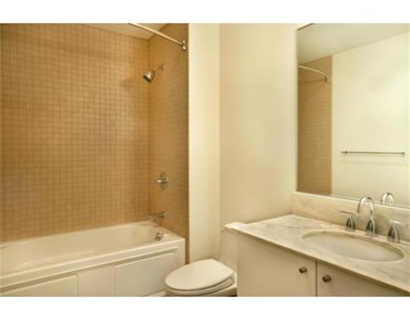 16 Miner Street, Unit 607 Boston, MA 02215 - Photo 9 of 10 a bathroom with a granite countertop sink toilet and shower
