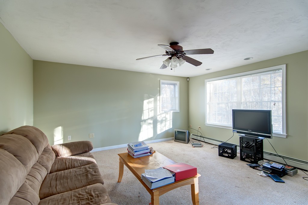 21 Corbin Road Dudley, MA 01571 - Photo 27 of 30 a living room with furniture and a flat screen tv