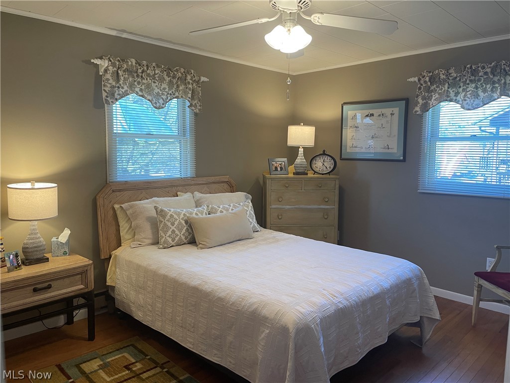 85607 North Bay Road Scio, OH 43988 - Photo 18 of 26 Bedroom featuring ceiling fan, wood-type flooring, and multiple windows