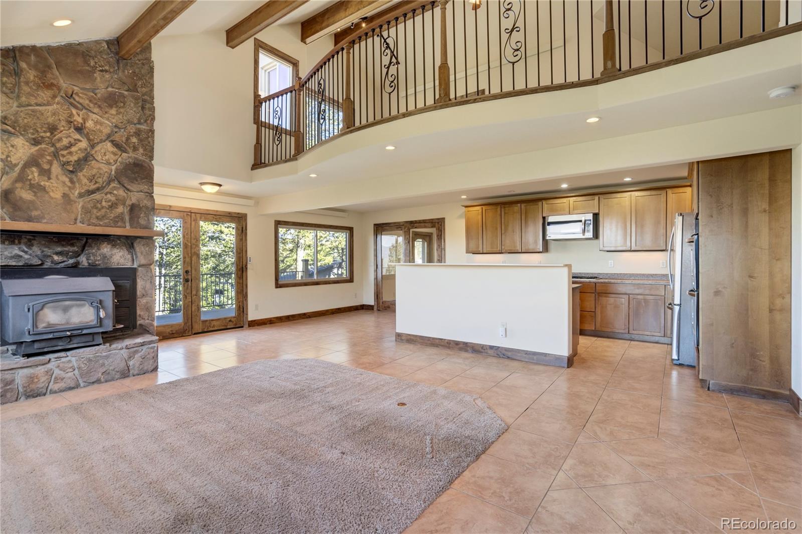 85 Santa Fe Mountain Road Evergreen, CO 80439 - Photo 12 of 47 a view of a livingroom with a fireplace