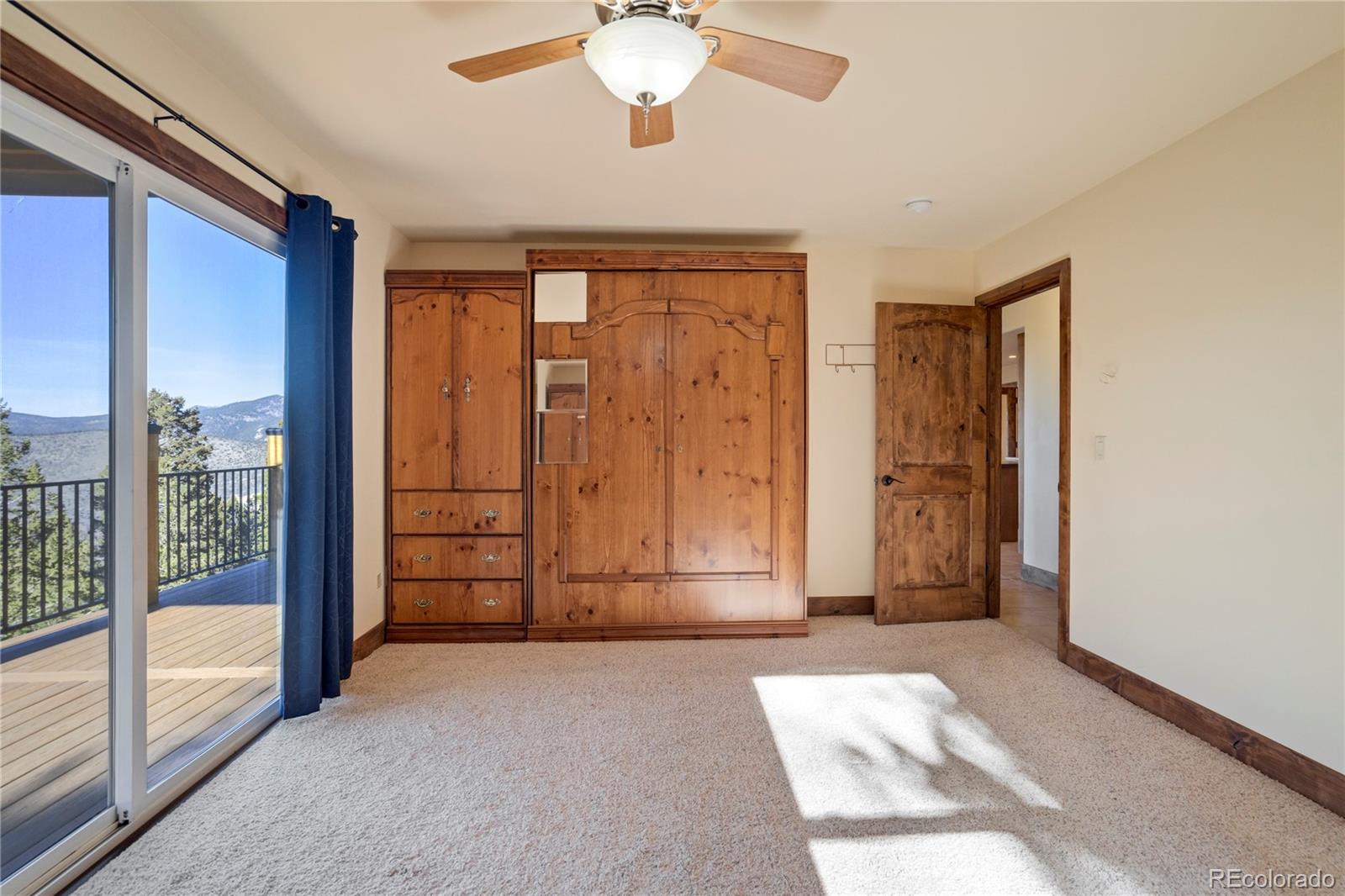 85 Santa Fe Mountain Road Evergreen, CO 80439 - Photo 23 of 47 a view of a livingroom with a chandelier