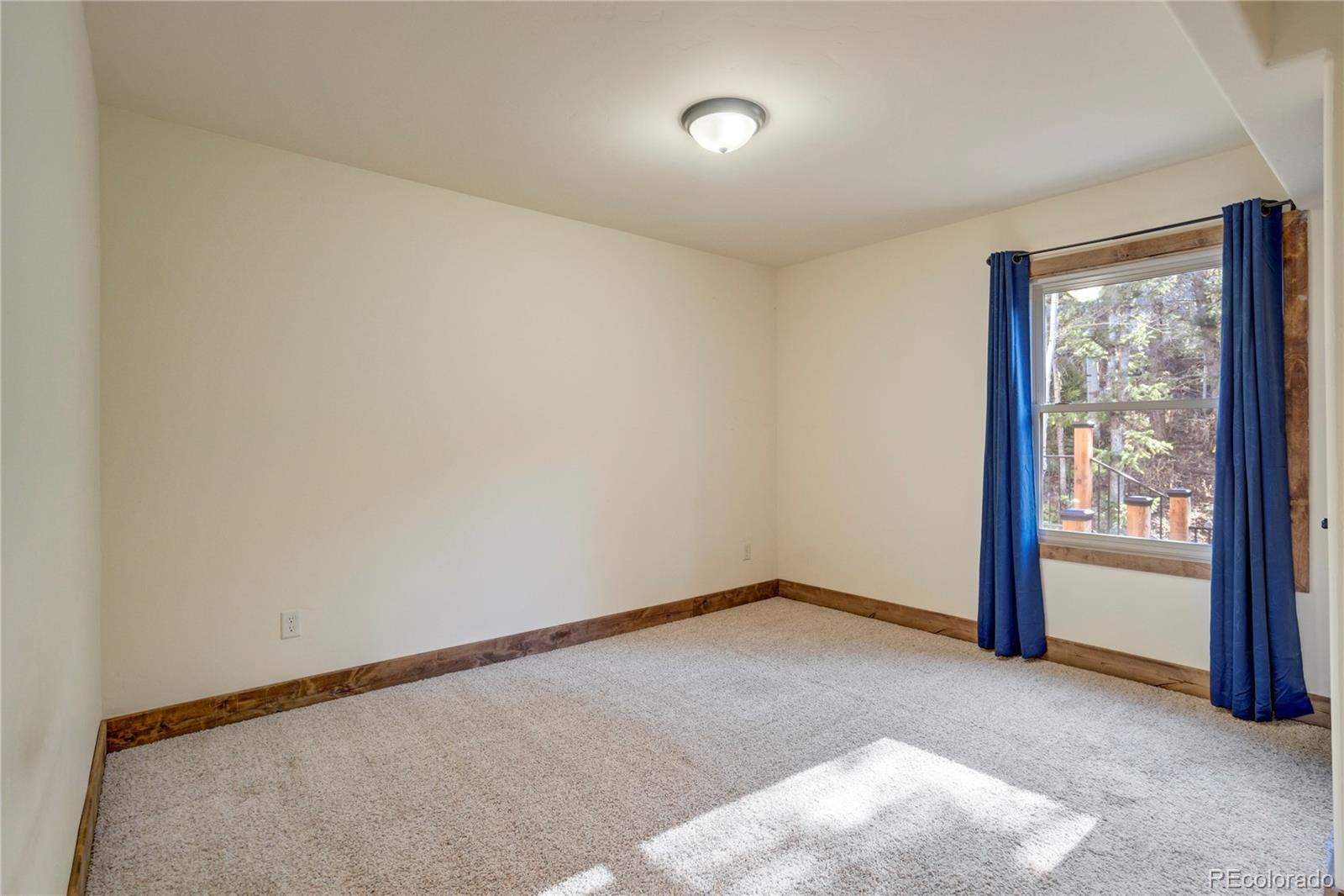 85 Santa Fe Mountain Road Evergreen, CO 80439 - Photo 26 of 47 a view of an empty room and window