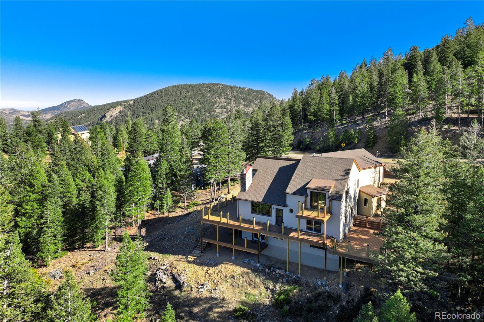 85 Santa Fe Mountain Road Evergreen, CO 80439 - Photo 40 of 47 an aerial view of a house with a yard