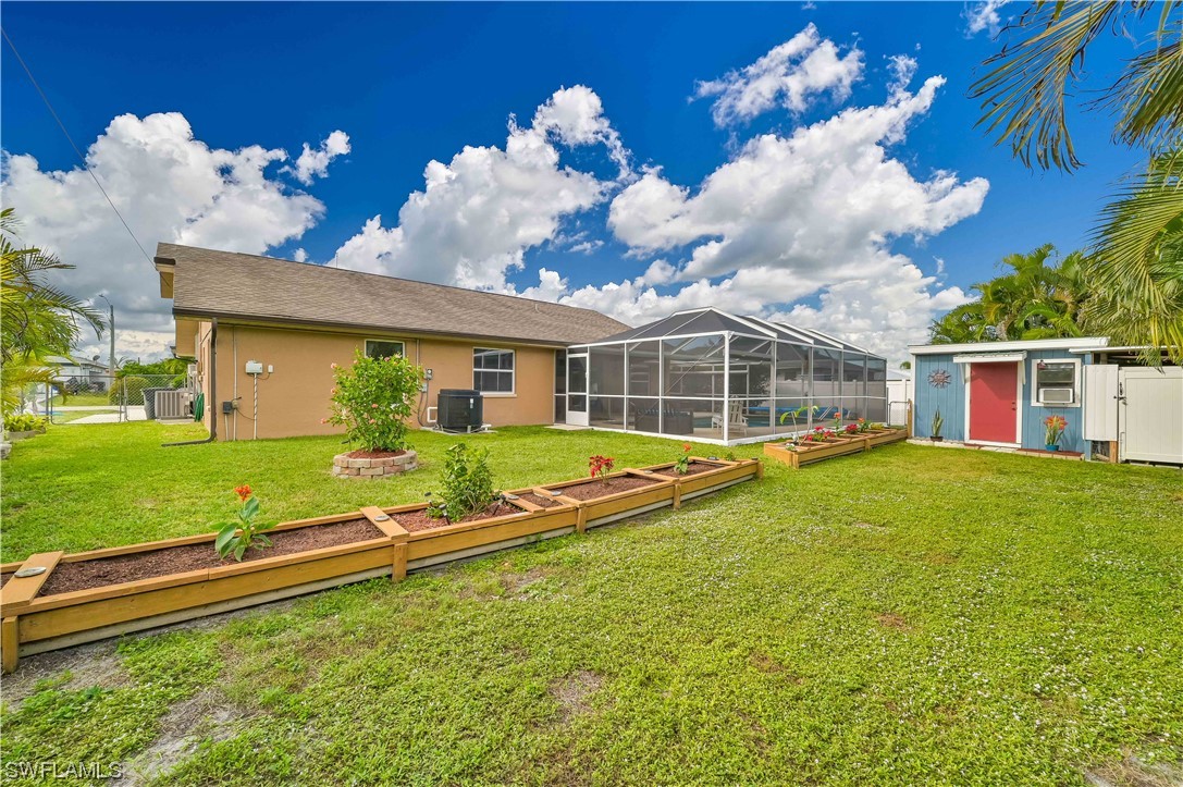 17433 Duquesne Road Fort Myers, FL 33967 - Photo 8 of 28 a view of a house with swimming pool and a yard