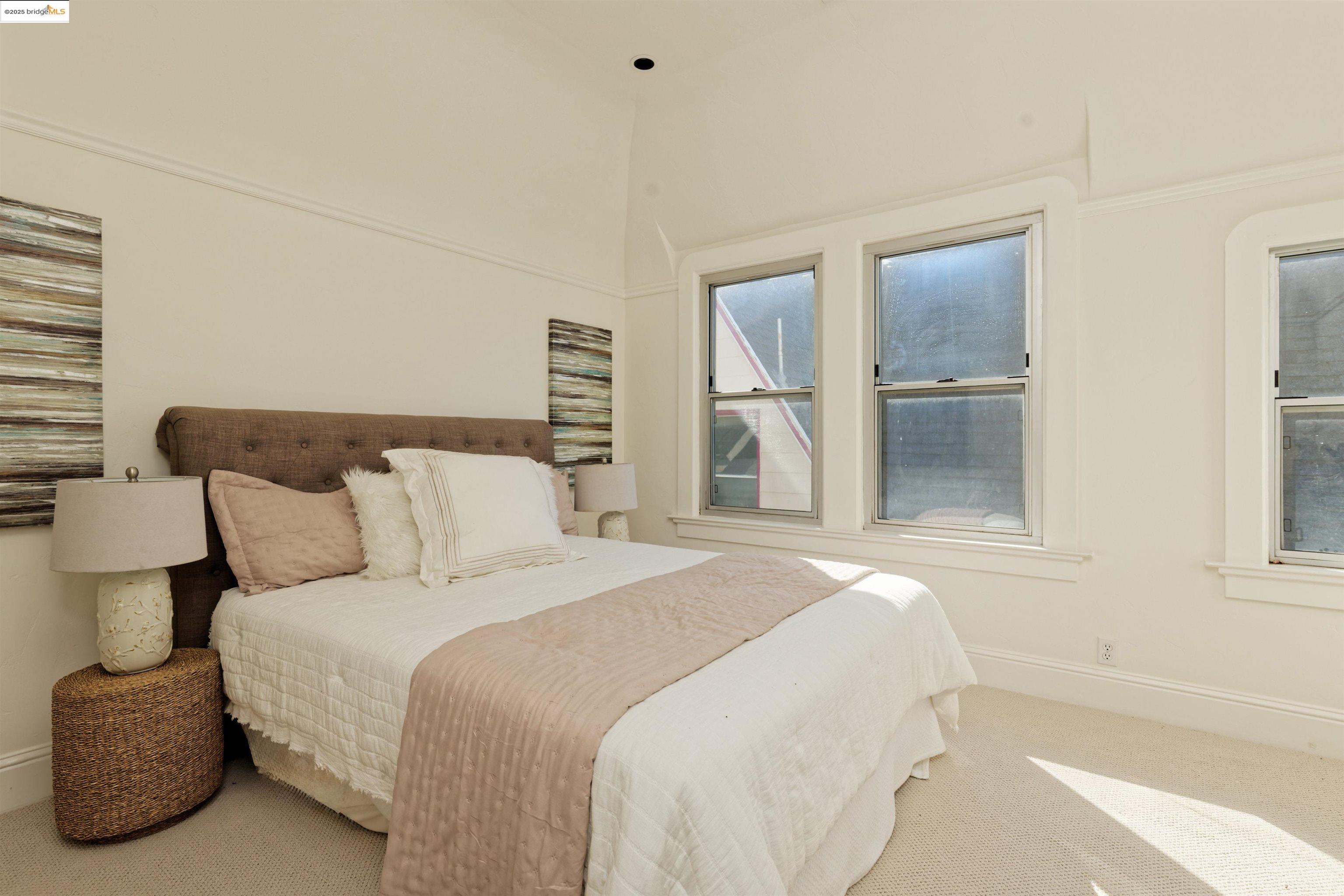 1033 Magnolia Street Oakland, CA 94607 - Photo 13 of 23 a bedroom with bed and window