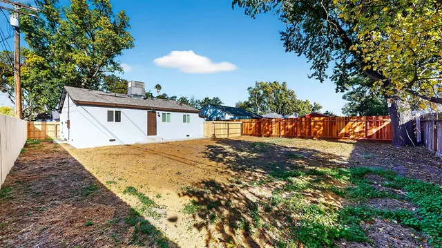 a view of a house with a tree