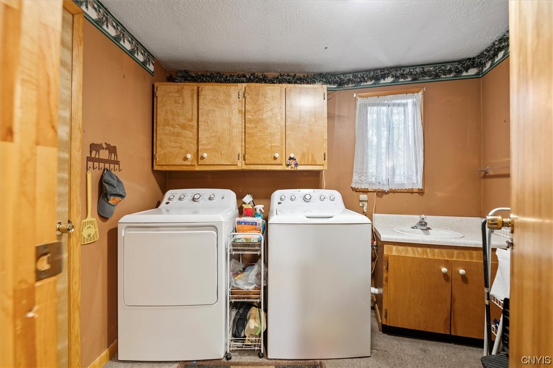 105 Riverside Drive Webb, NY 13420 - Photo 14 of 22 First floor laundry and half bath