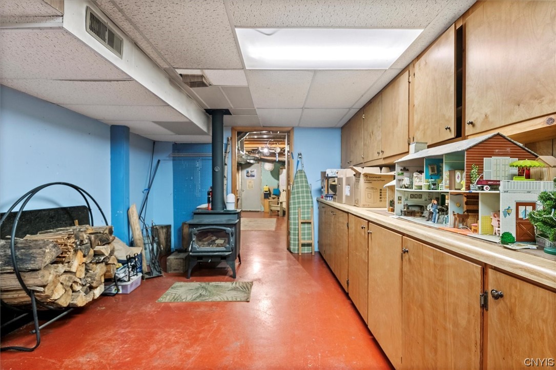 105 Riverside Drive Webb, NY 13420 - Photo 21 of 22 Full basement with wood stove and lots of storage