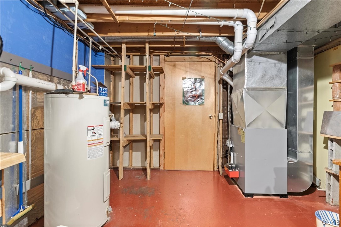 105 Riverside Drive Webb, NY 13420 - Photo 22 of 22 Separate room with utilities and door to extra gar